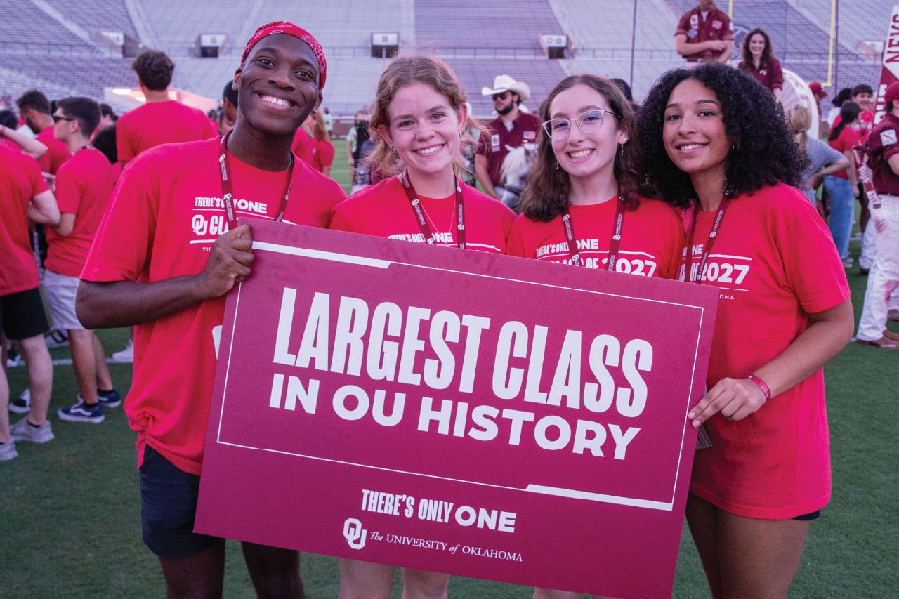 Students from the class of 2027 hold a crimson sign that says "Largest Class in OU's History" while celebrating Class Kickoff, held at the Gaylord Family - Oklahoma Memorial Stadium.
