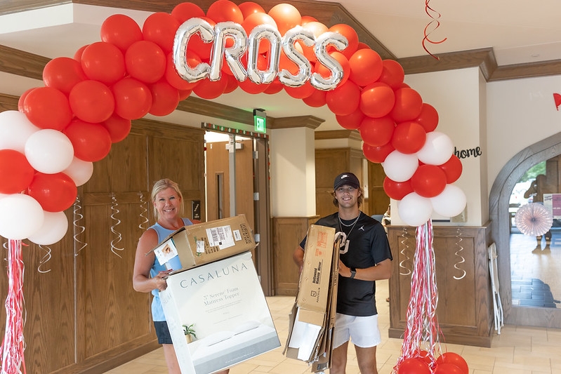 Mother and son moving into Cross Village
