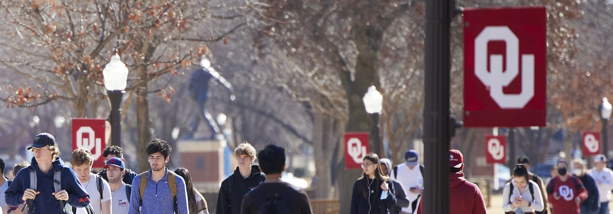 Students walking in the south oval during a sunny winter day on OU's campus in Norman, OK