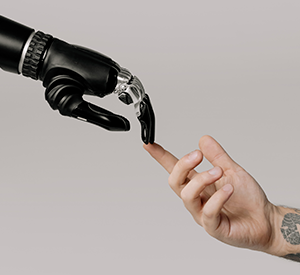 Robot hand and human hand. Stopck photo: pexels-cottonbro-studio