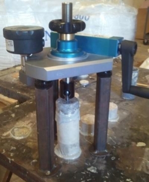 Direct tension testing of concrete overlay systems