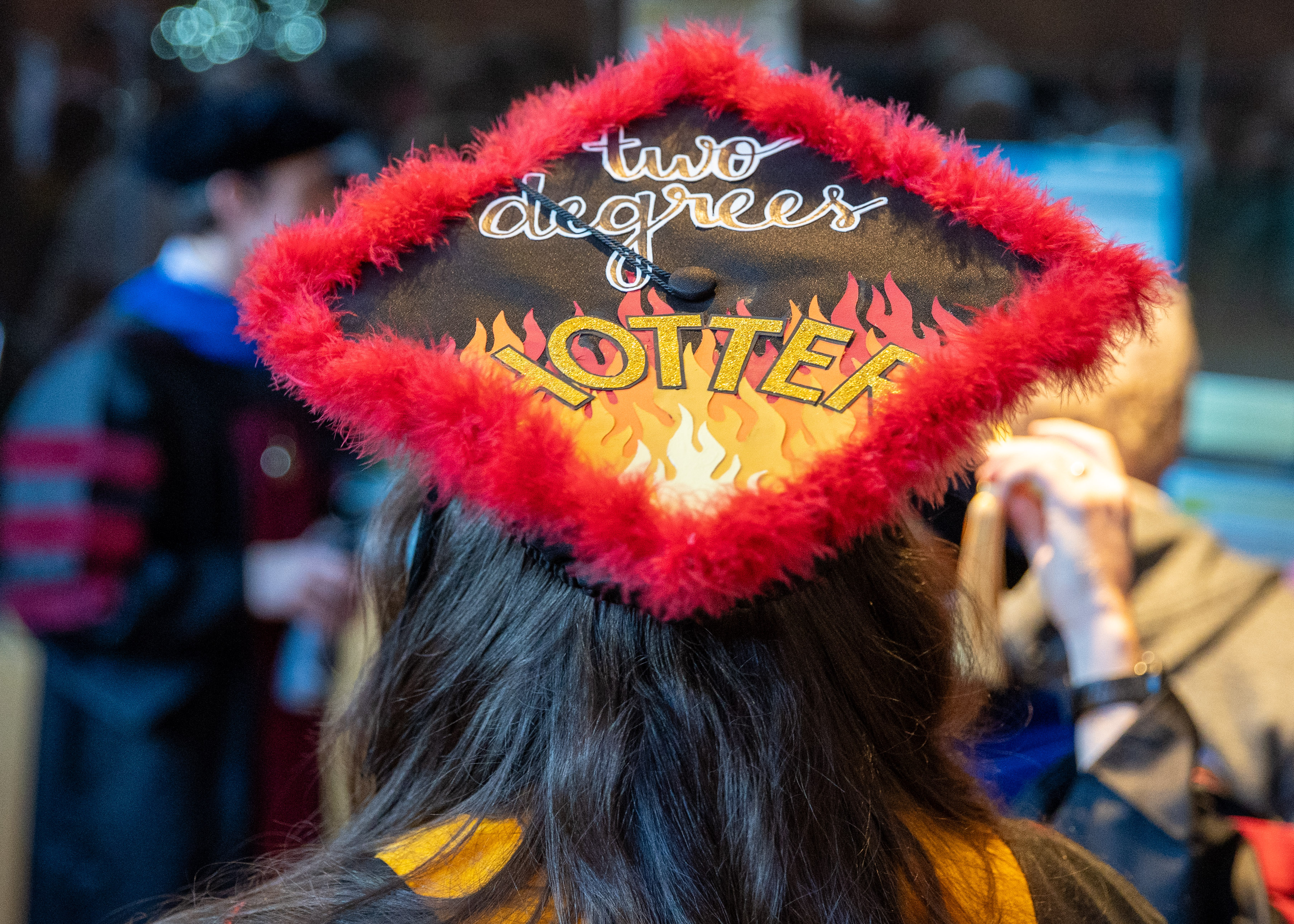 A&GS Grad cap with "Two Degrees HOTTER" written on the top.