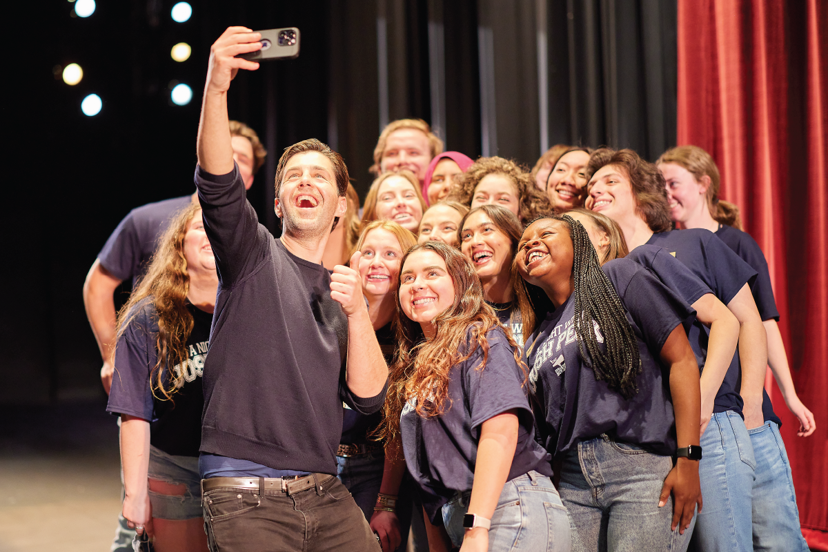 OU students pose on stage with actor Josh Peck after CAC Event featuring the actor