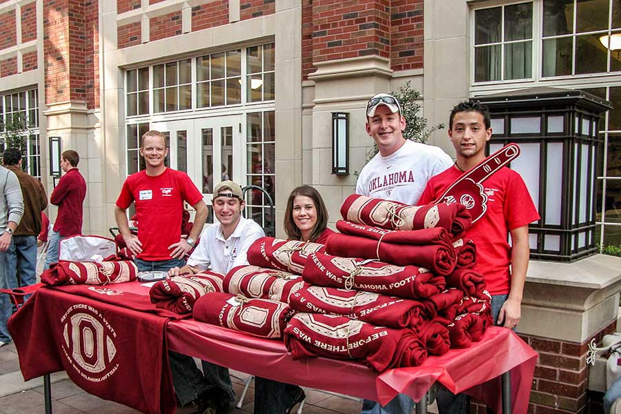One of the Price First Fidelity IBC teams displaying their OU branded gear for sale in Dodson courtyard. 