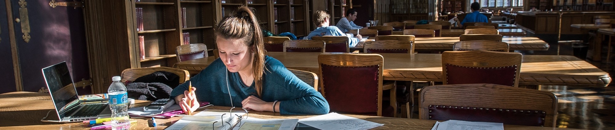 Students studying in the Great Reading Room in Bizzell Memorial Library.