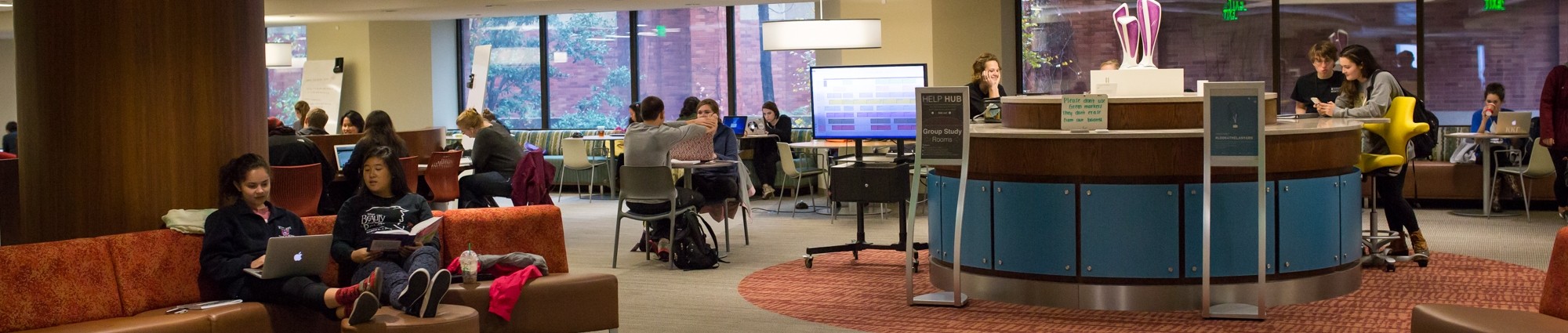 Students interact in the Helmerich Collaborative Learning Center in Bizzell Memorial Library.