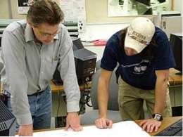 professor teaching a student during a technical production course
