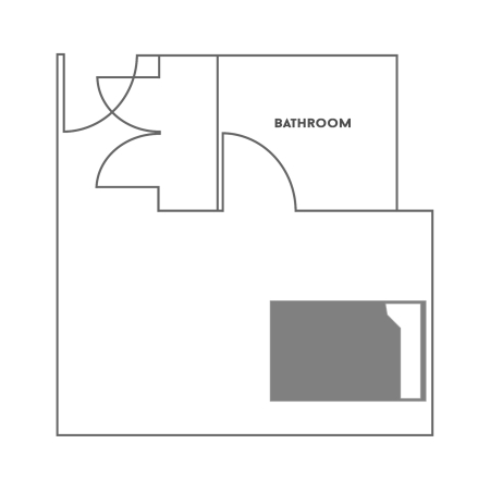 Floor plan for a One Bed with Bath in the Residential Colleges. The room shows a full-size bed, a desk with a chair, a dresser and a closet. The bathroom has a toilet, sink and shower.