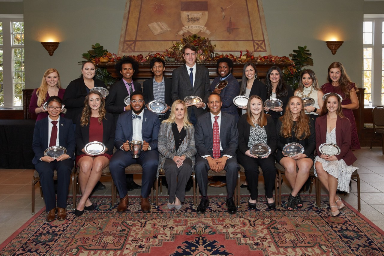 Award winners seated for group portrait, names listed in article.