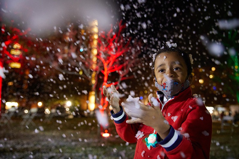 A child plays in artifical snow
