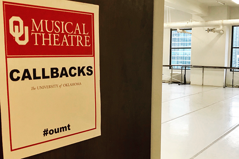 Musical Theatre 'CALLBACKS' sign hangs on door outside audition space