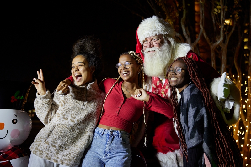 Students post for a photo op with Santa