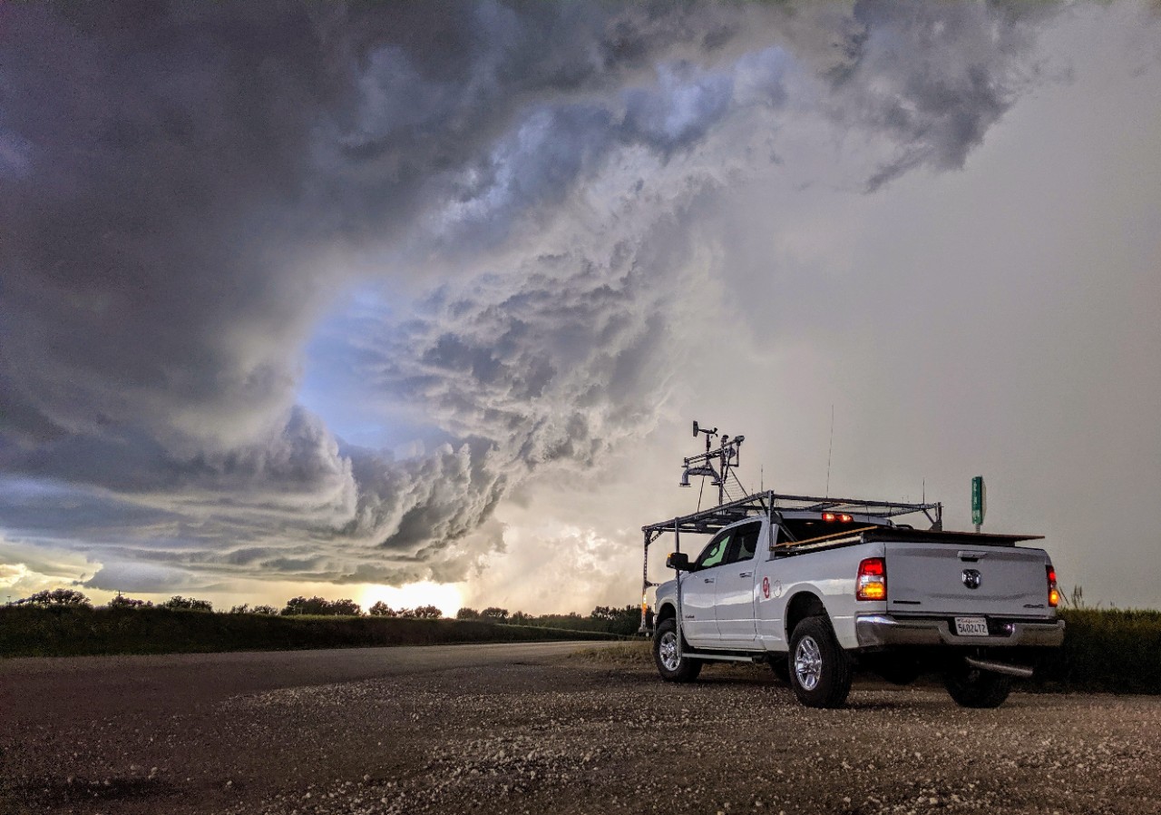 Weather monitoring TORUS vehicle is parked on gravel at the edge of a storm front.