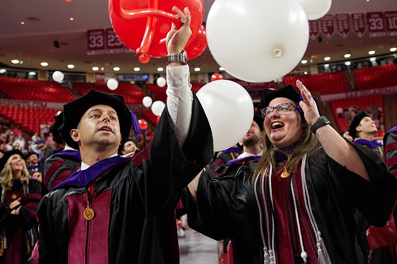 Students celebrate as baloons are dropped for the Law graduation in LNC