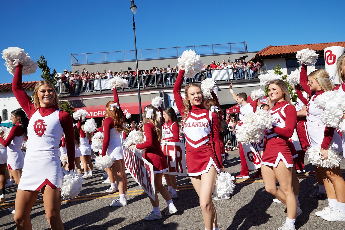 OU Pom performs at the parade down Boyd street