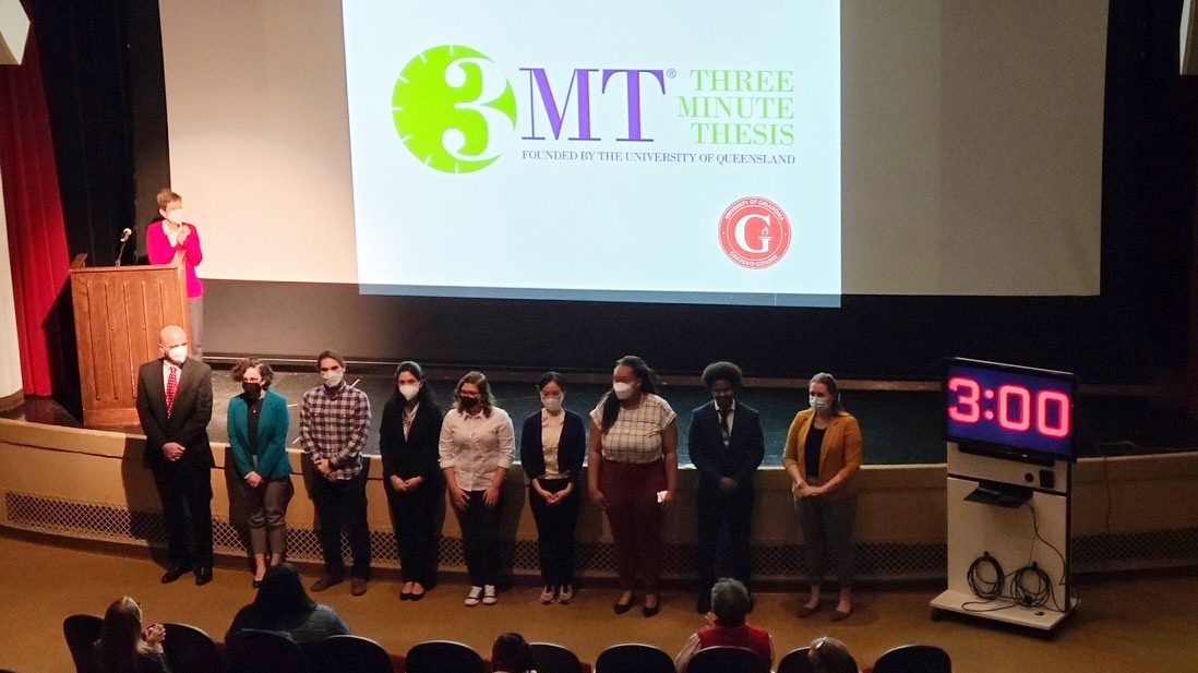 3MT group poses on stage