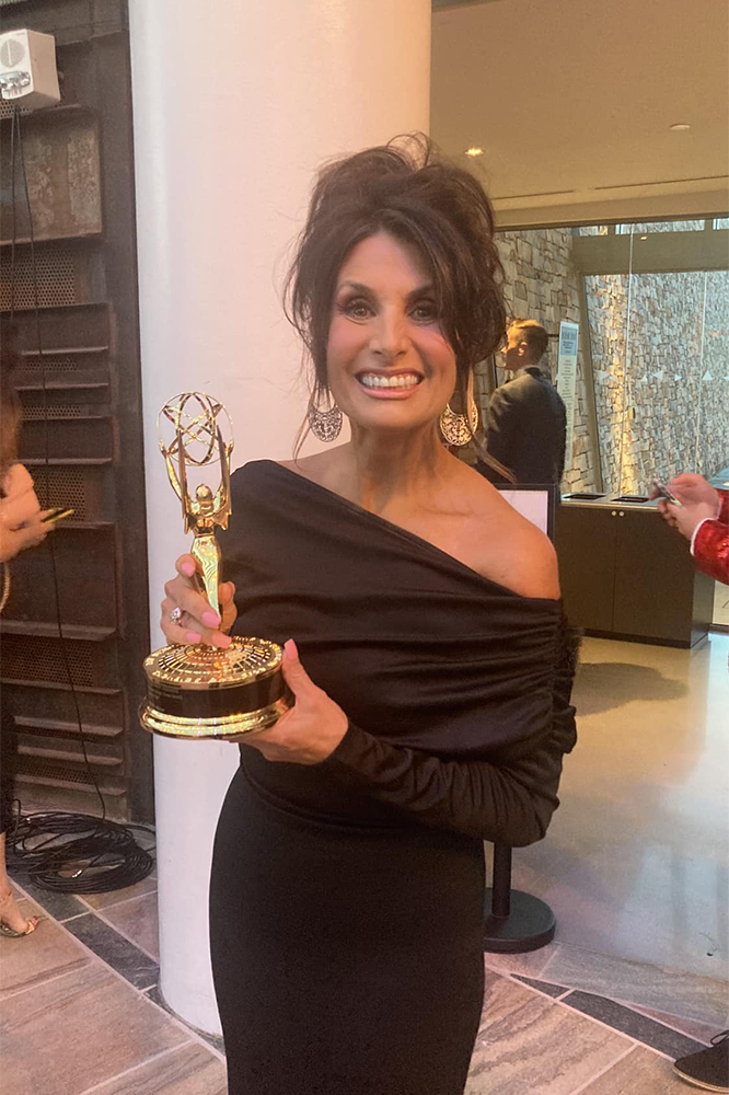 Robin Marsh poses with her Emmy during an indoor event