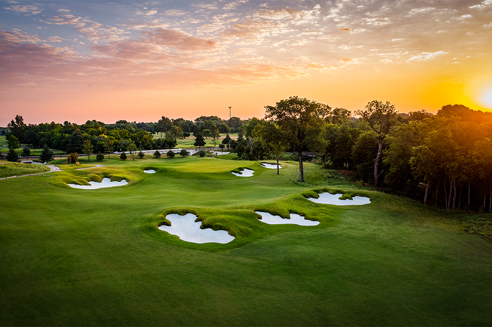 Aerial view of Jimmie Austin golf course at sunset
