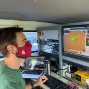 Graduate student Addison Alford operates the radar within the mobile radar truck. OU.