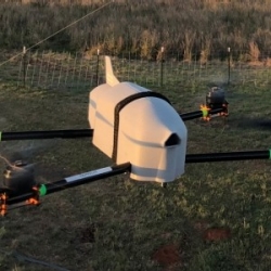 A CASS quadcopter drone, the Coptersonde 2, flies in a field.