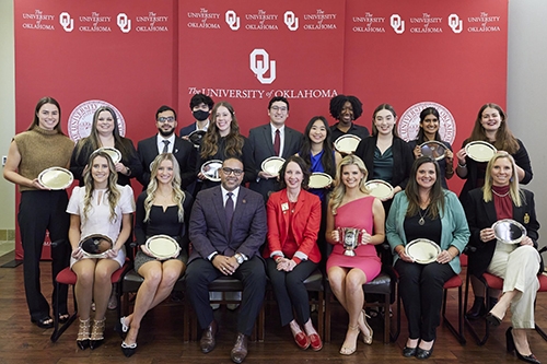 Atwell sitting in the front row alongside other Fall 2023 OU Outstanding Seniors.