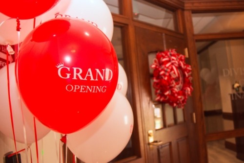 Close up photo of decorations around the new Finance division office. A group of balloons reads "Grand Opening" 