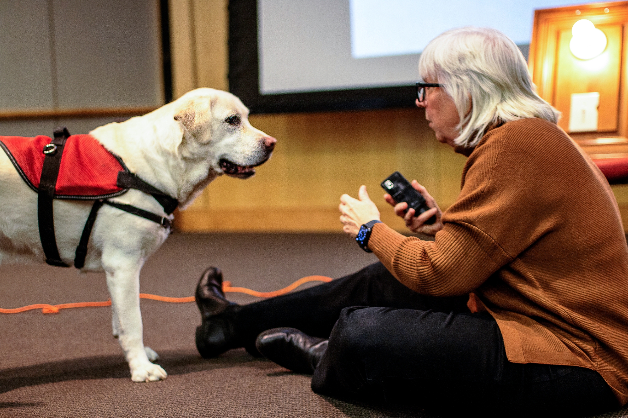 Professor Paws and Mary Isaacson sharing and demonstrating his abilities during presentation