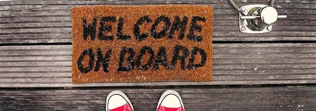photo of welcome mat that says welcome on board
