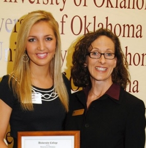 Dean Nicole Campbell stands with a student winner of one of the 2011 University College awards; picture sized for feature tab