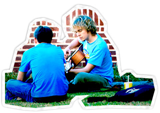 Student with friend playing guitar