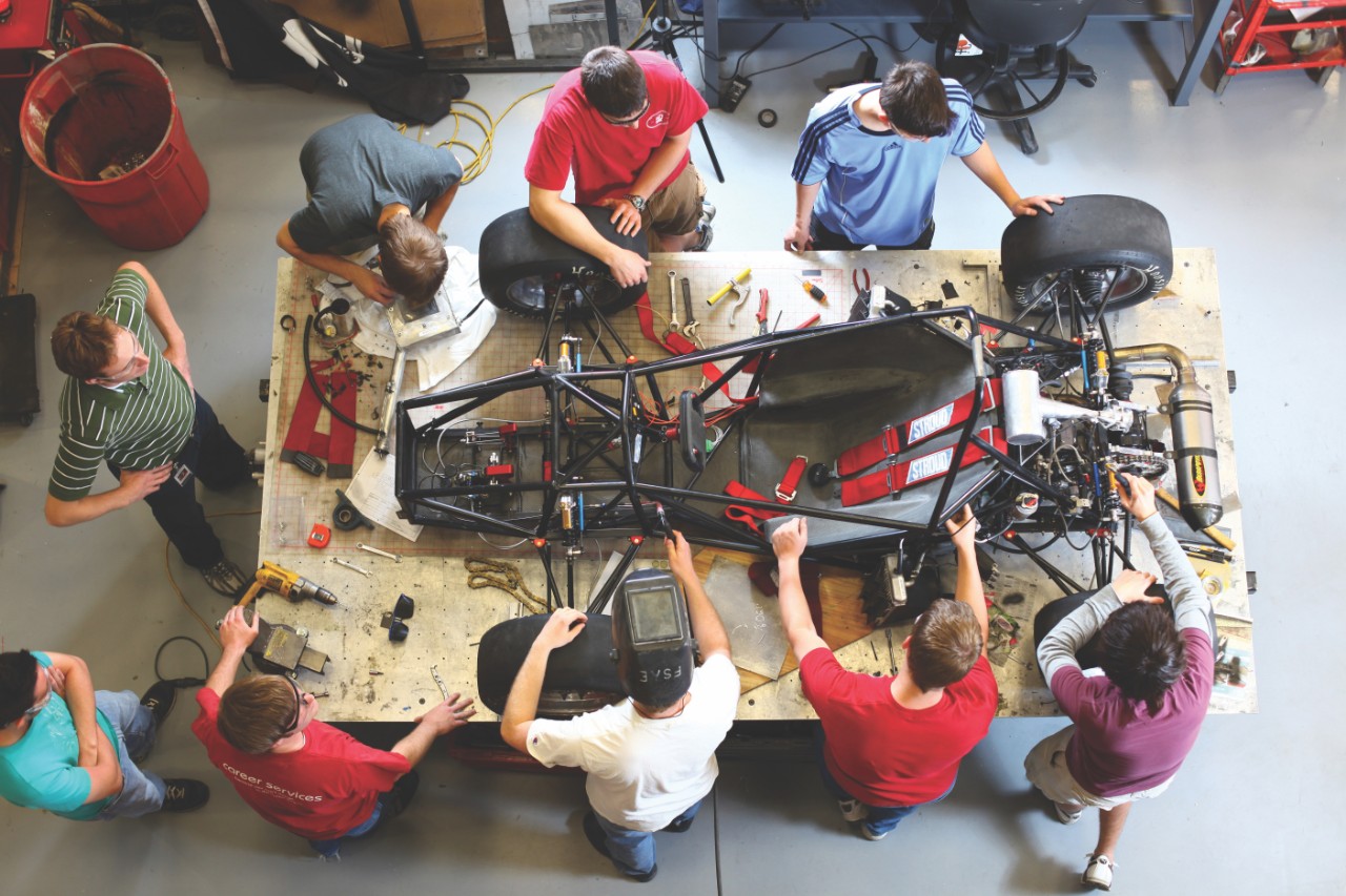 OU Engineering students working on the Sooner Racing Team car
