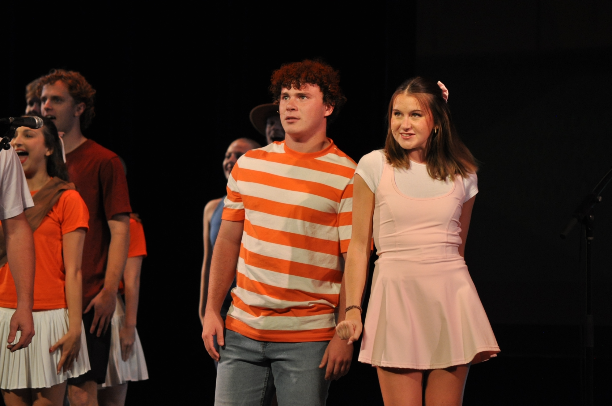 A close-up of two performers. 