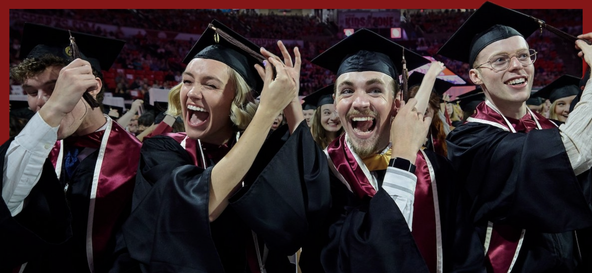 Students turning their ribbons on their graduation cap