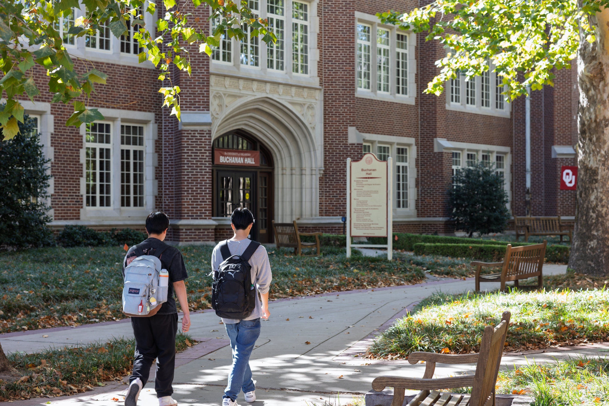 Two students walking outside of Buchanan Hall