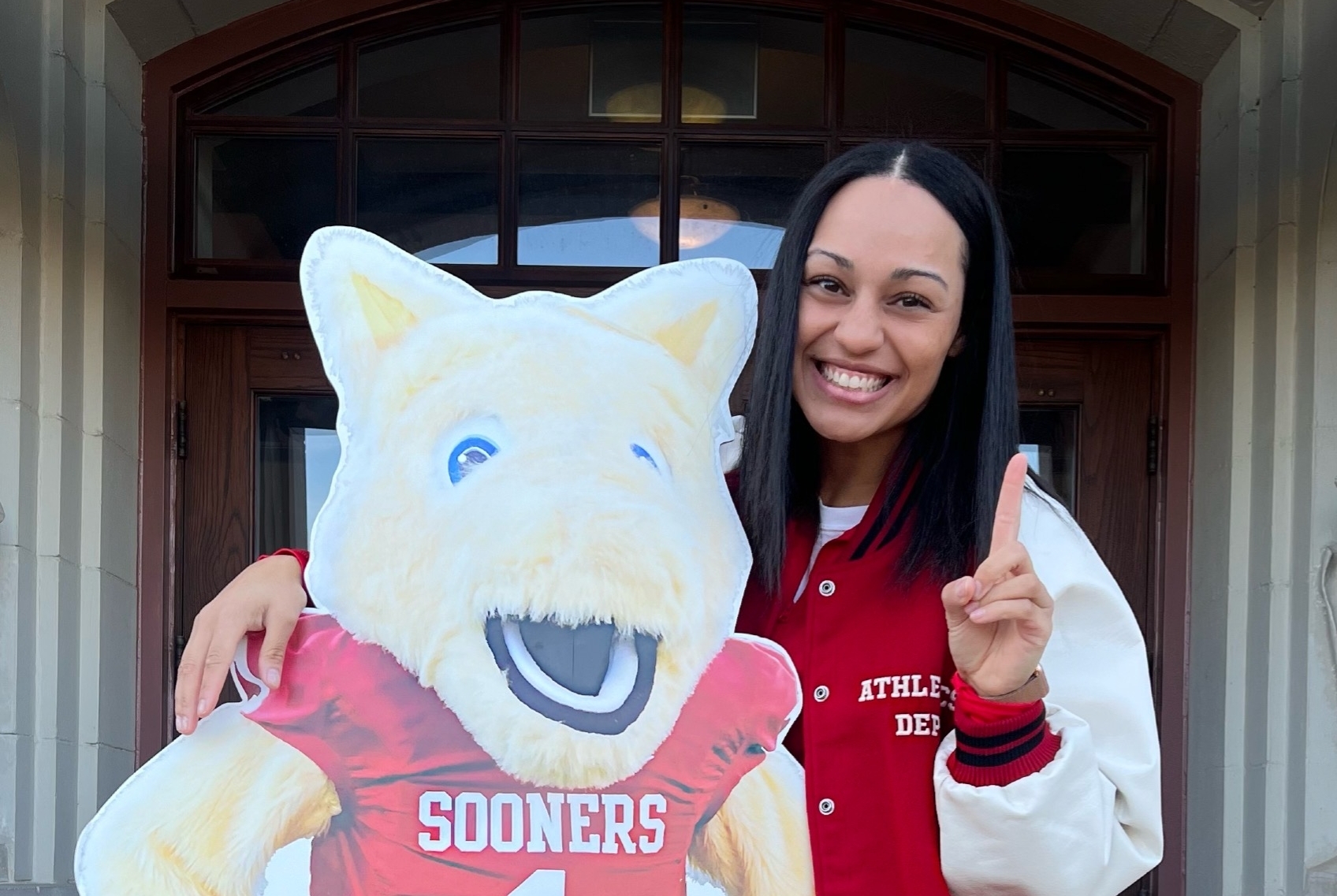 Katie posing with a cut-out of one of OU's mascots, Boomer