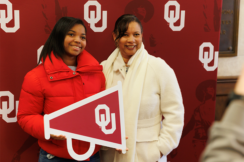 Student and supported taking a photo together at Scholars' Day