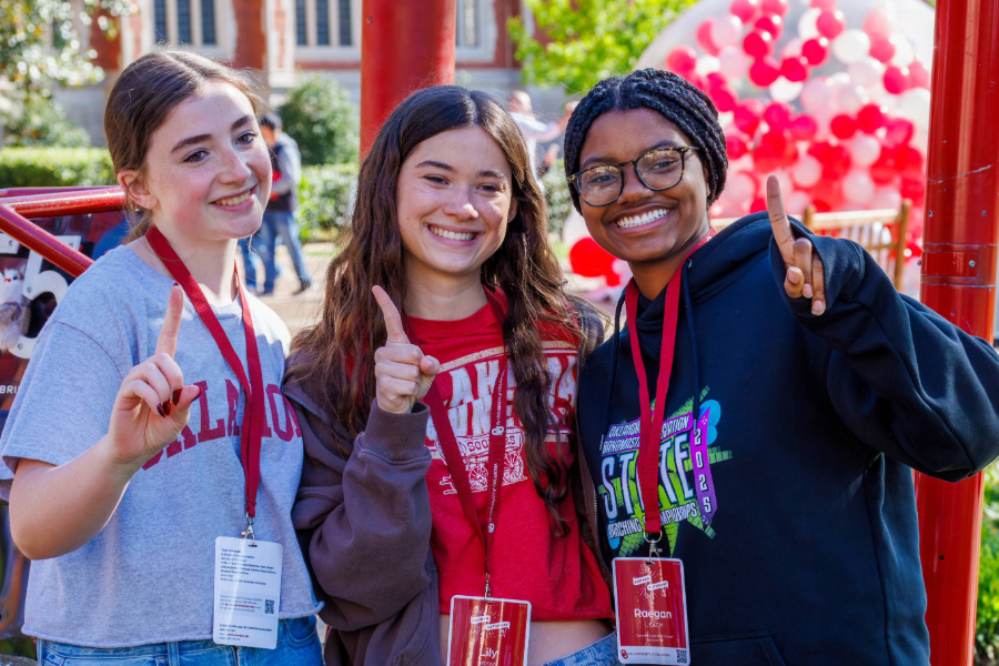 Prospective students posing for a photo at Sooner Saturday 2026