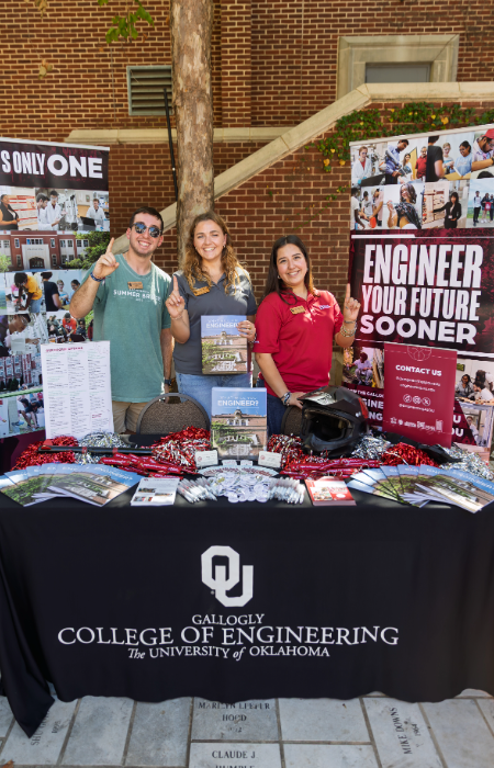 Three students tabling with Gallogly College of Engineering at Sower's Day 2025