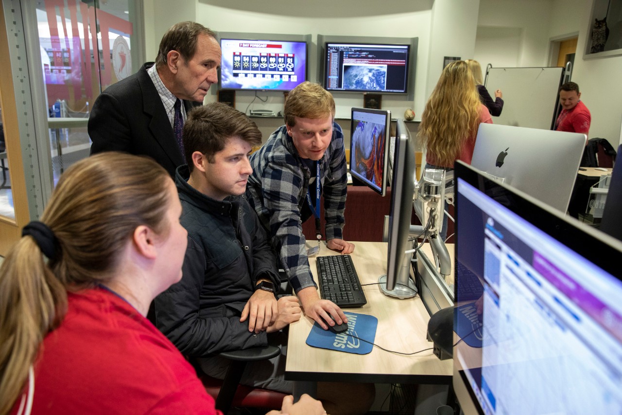 Dean Moore reviews storm data with students in the Oklahoma Weather Lab (OWL).