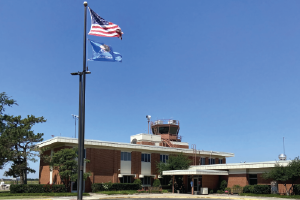 An exterior view of the Max Westheimer Airport Terminal on a sunny day. Max Westheimer Airport Terminal
