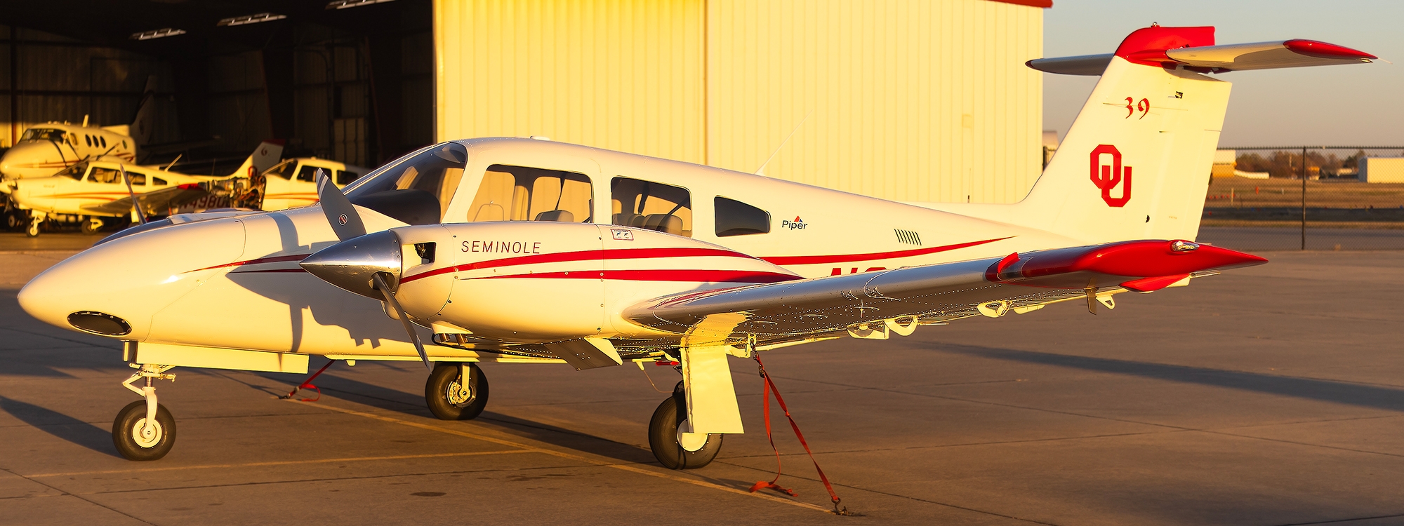 A P A 44-180 Seminole aircraft on a runway.