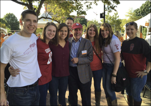 Dean Berrien Moore celebrates homecoming with A&GS majors before the annual homecoming parade.