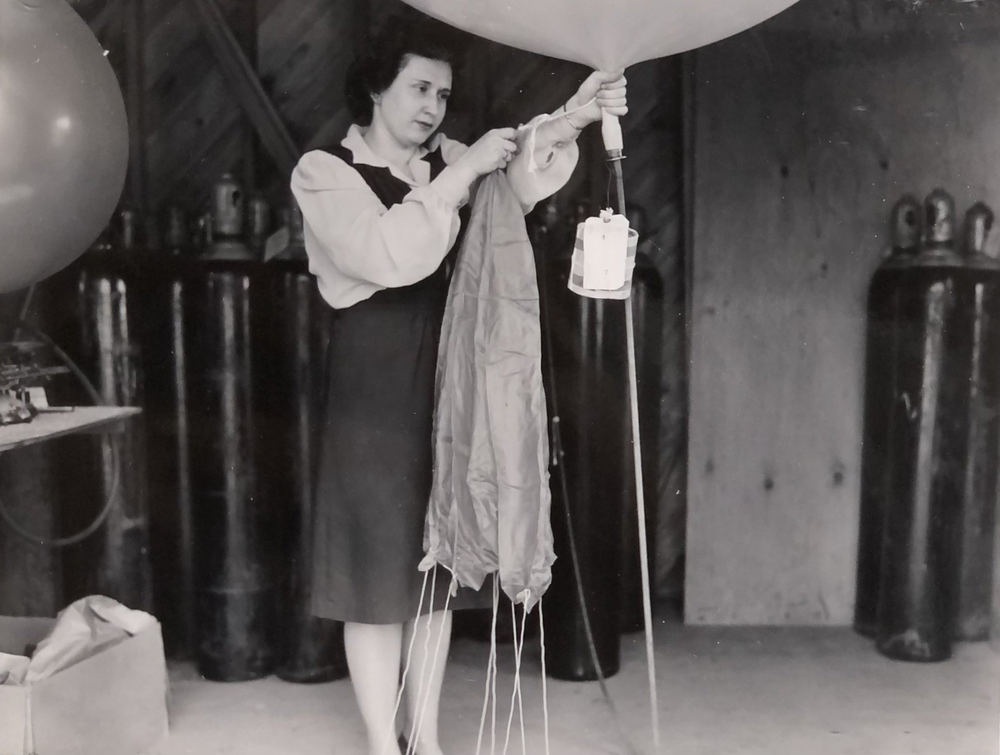  WW2 Woman Meteorologist tying off weather balloon