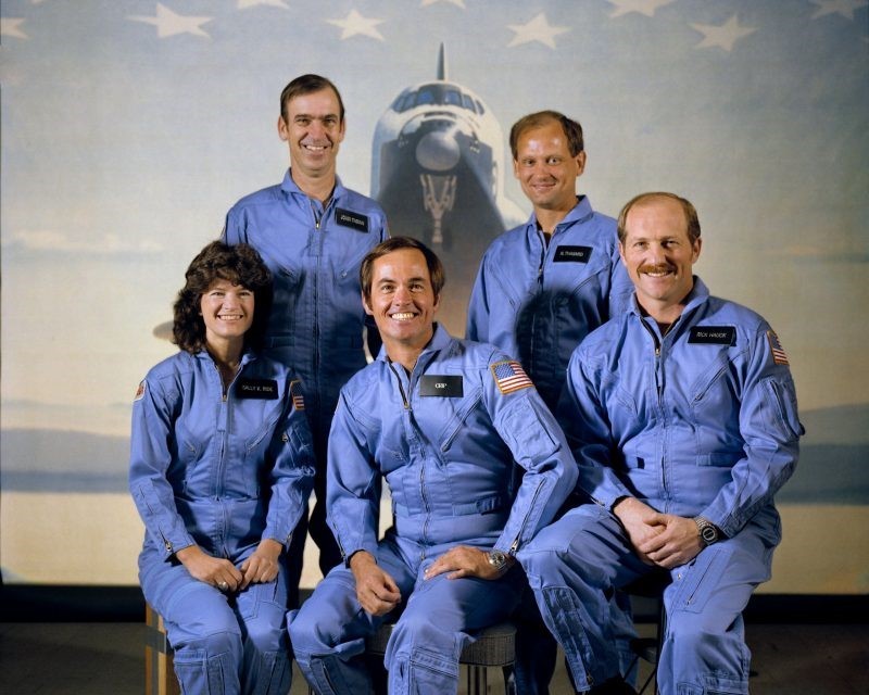 The crew of the STS-7 space shuttle Challenger mission in 1983. Front row, left to right: Sally K. Ride (mission specialist), Robert L. Crippen (commander), and Frederick H. Hauck (pilot). Back row, left to right: John M. Fabian and Norman E. Thagard (mission specialists). Image via NASA.