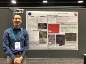  James Worden standing by his AGU poster presentation