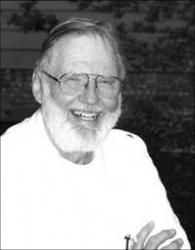  Dr. Douglas Lilly, sporting an infectious smile and a full white beard.