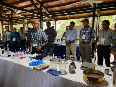 Julio Alegre, Ph.D., a professor at UNALM and the Peruvian coordinator of the soils and crops team, demonstrates a soil analysis kit.