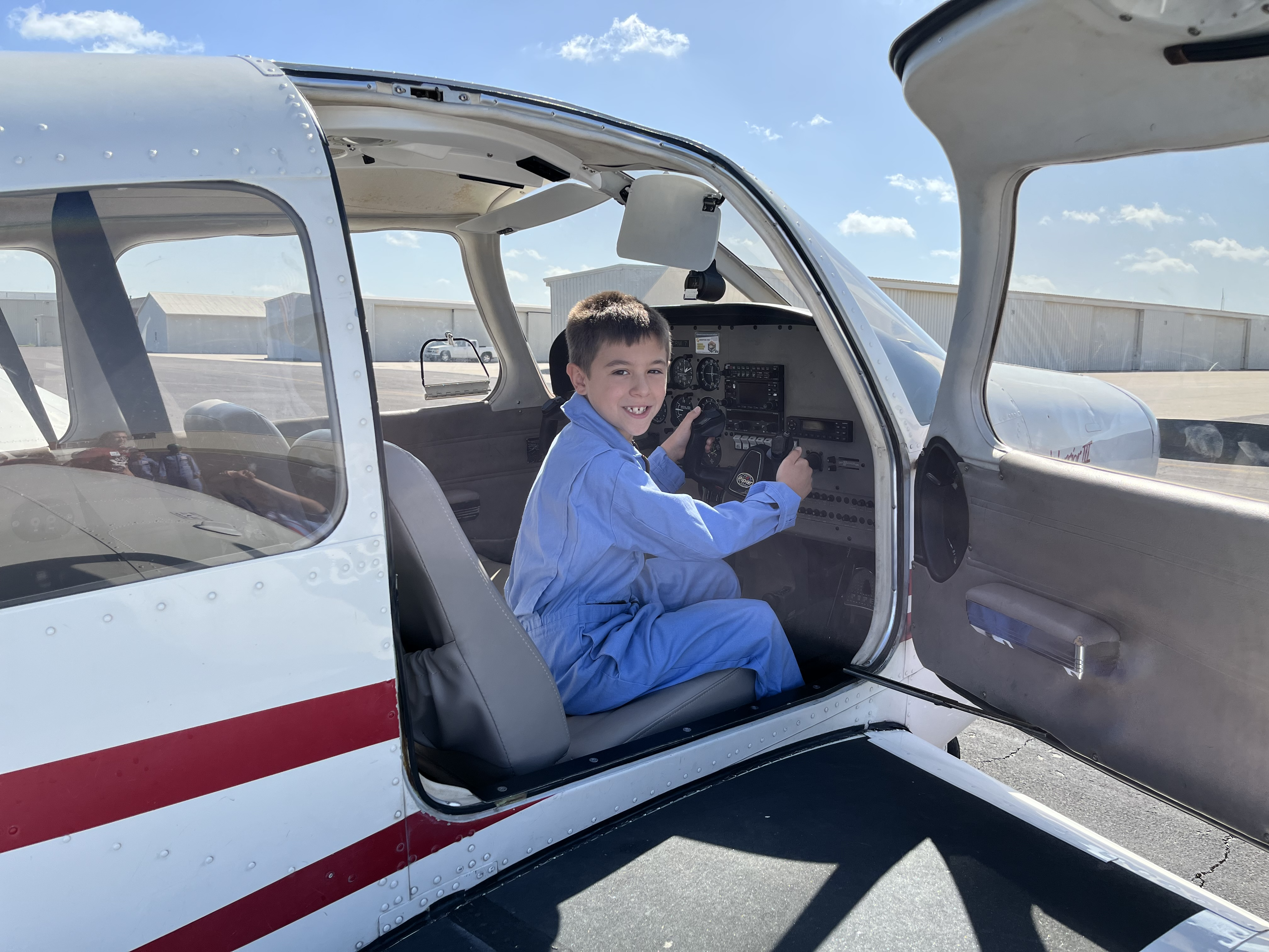 K-12 Sooner Flight Academy Student in the cockpit of an Piper PA-28-161 Warrior III