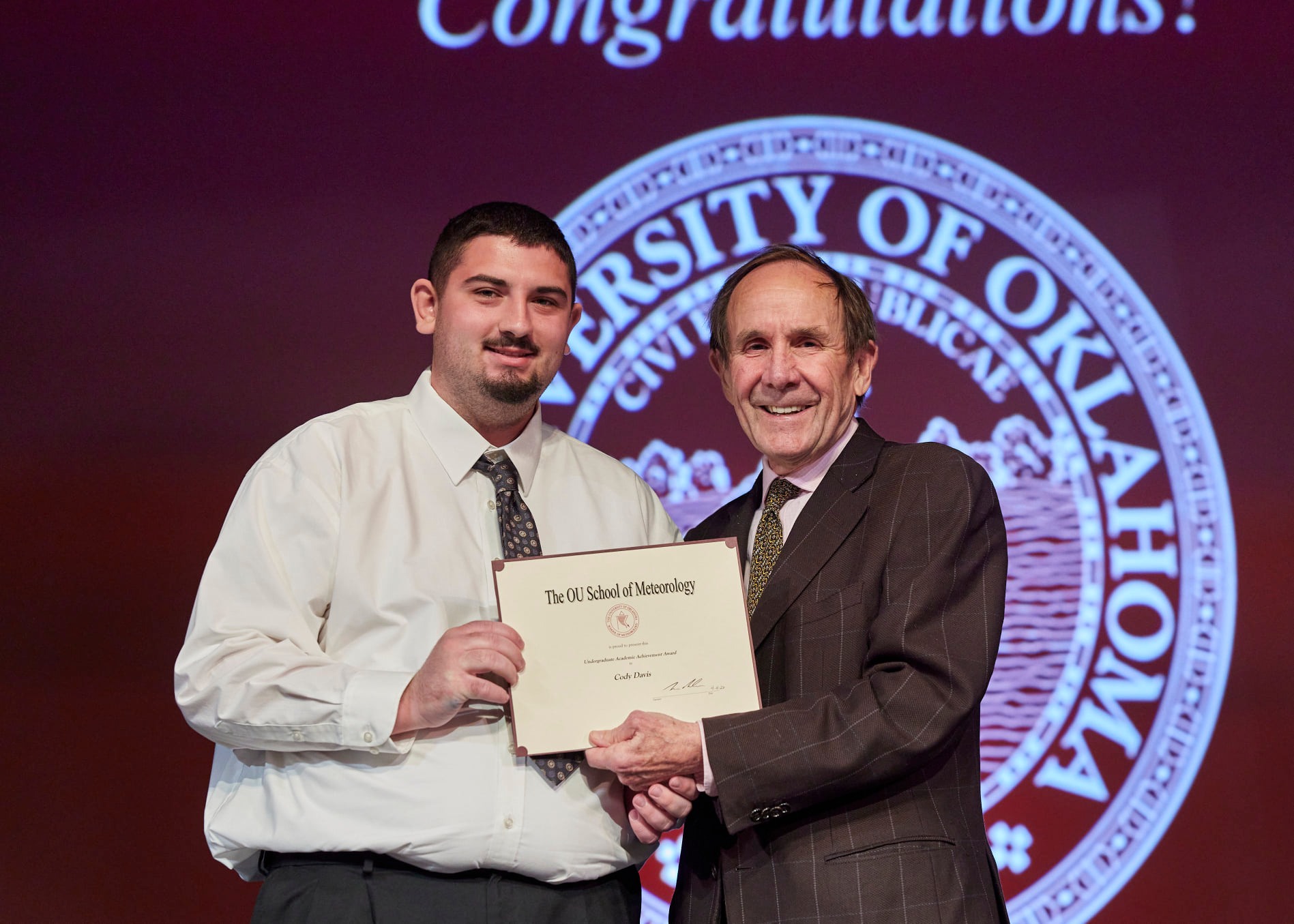 School of Meteorology Undergraduate Academic Achievement Award - Cody Davis with Dean Berrien Moore