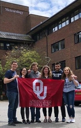 Meteorology students pose with the OU flag during their Study Abroad Semester in Reading, England. Meteorology. OU Sooners.